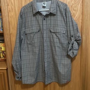 Men’s The North Face tan and gray plaid button down shirt.